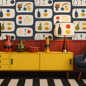 A styled interior scene featuring a bold mid-century modern wallpaper with a repeating fruit and vase pattern, a bright yellow sideboard cabinet, two matching table lamps, decorative ceramic vases, a dark blue armchair with a patterned pillow, and a black-and-white striped rug.