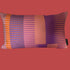 Decorative pillow with purple and orange stripes on a white background