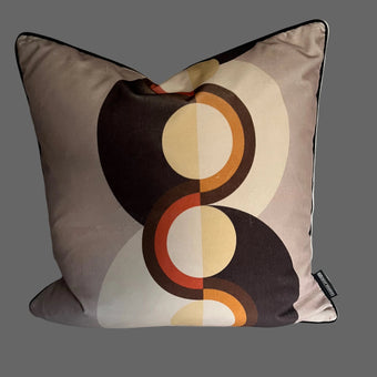 Decorative pillow with circular pattern on a plain background
