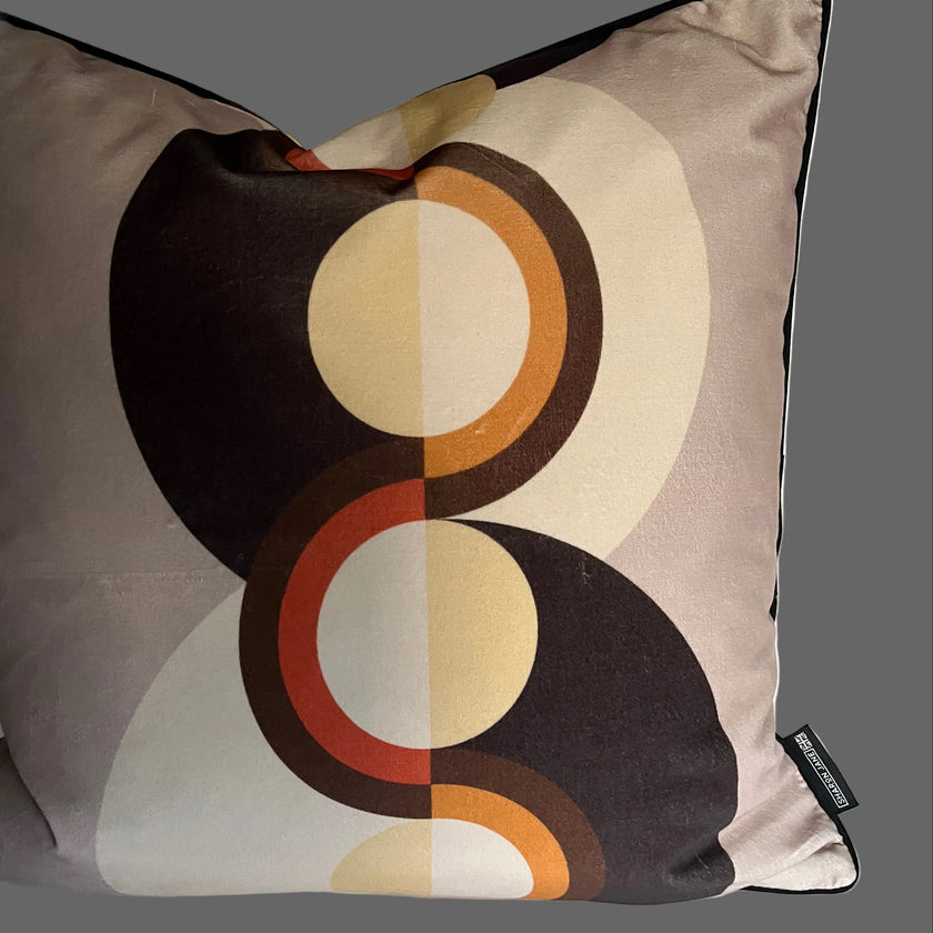 Decorative pillow with circular pattern on a plain background