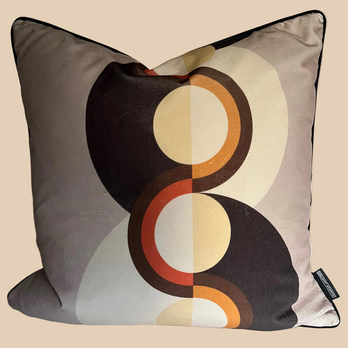 Decorative pillow with circular pattern on a plain background