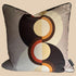 Decorative pillow with circular pattern on a plain background