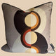 Decorative pillow with circular pattern on a plain background