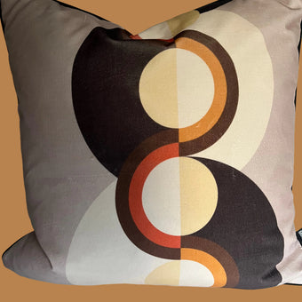 Decorative pillow with circular pattern on a plain background