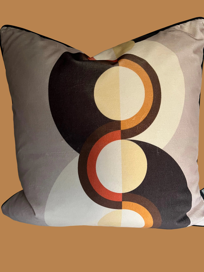 Decorative pillow with circular pattern on a plain background