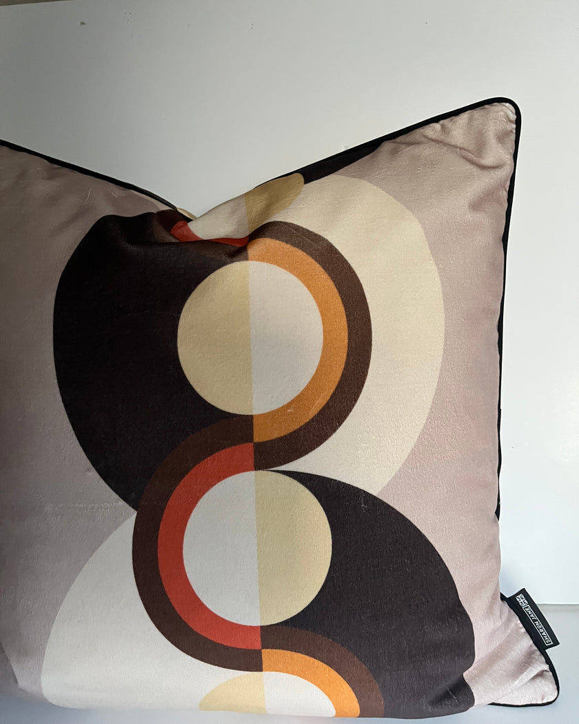 Decorative pillow with circular pattern on a plain background