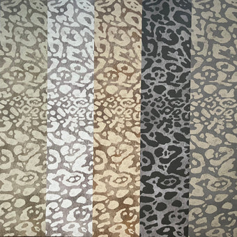 Striped pattern with alternating dark and light gray, beige, and brown colors.